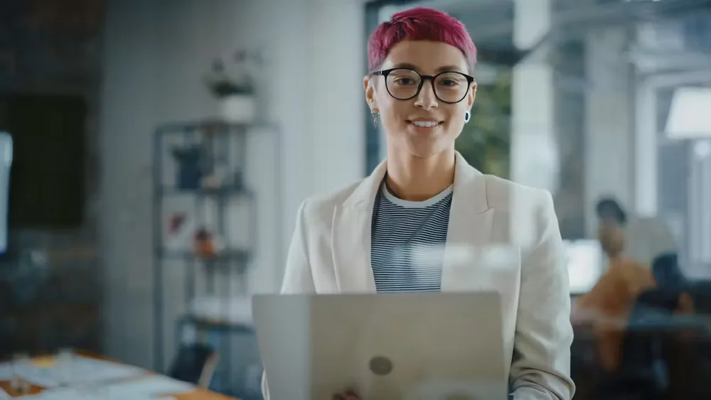 Women using laptop on table with smile